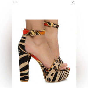 Bamboo 7 & 1/2 One band Leopard print platform heels. Adjustable strap w/buckle.